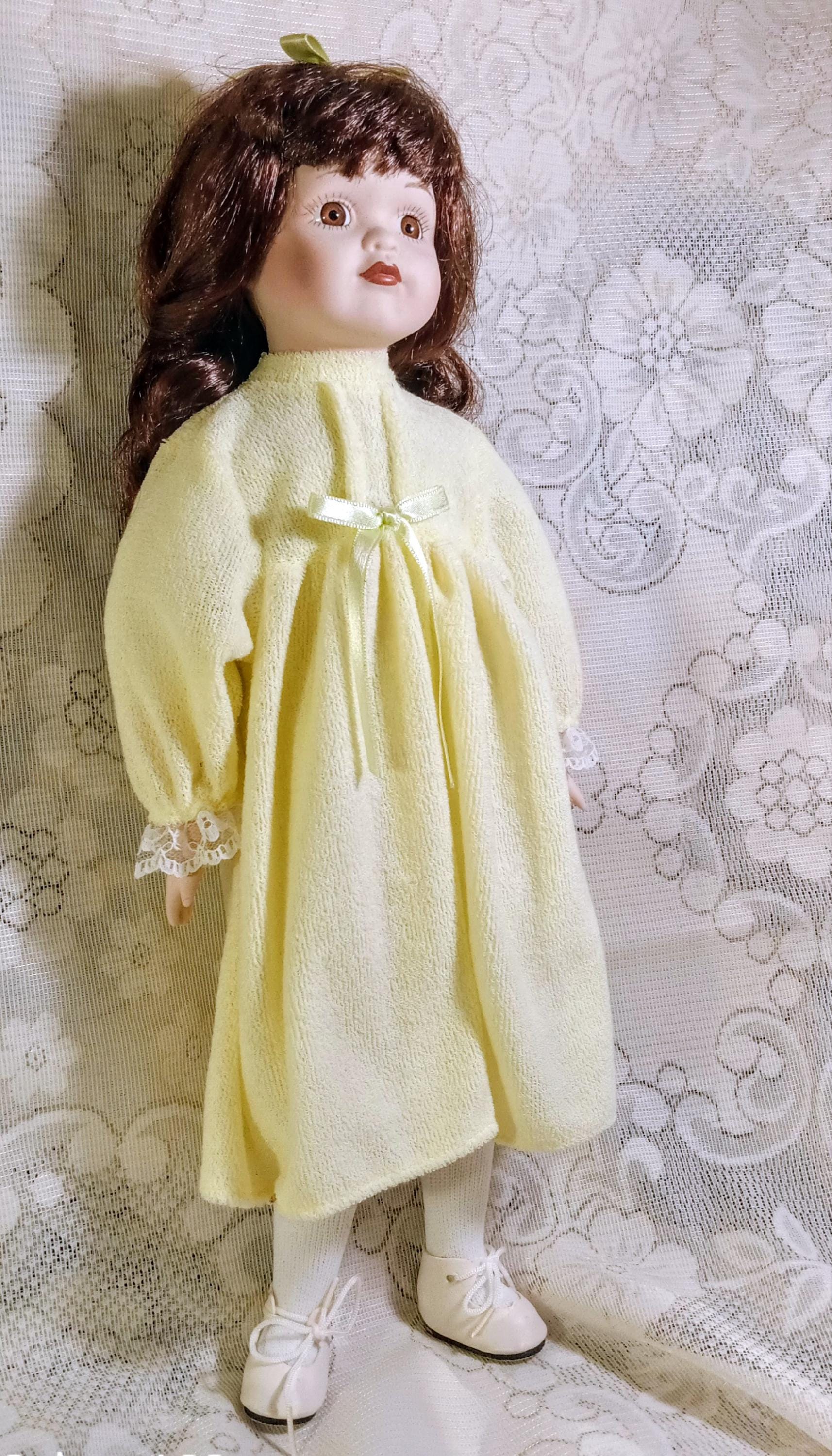 Vintage Porcelain Doll by  Galeria Inc - Includes 2 Dresses