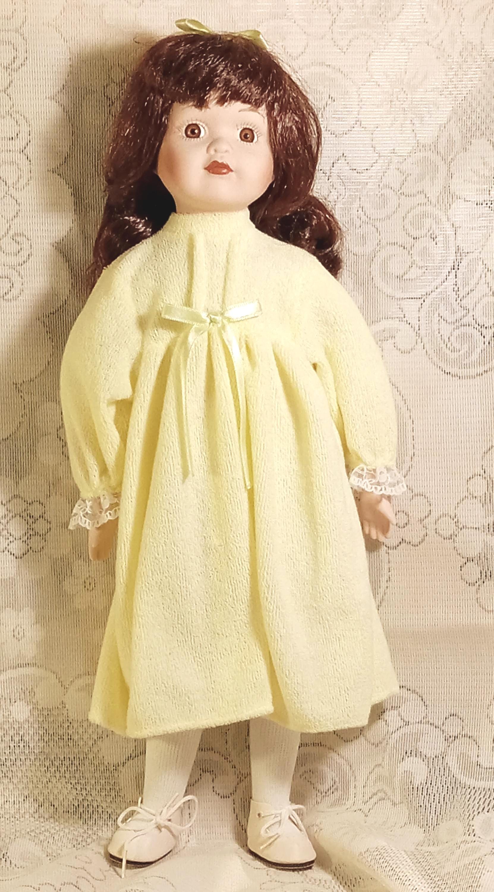 Vintage Porcelain Doll by  Galeria Inc - Includes 2 Dresses