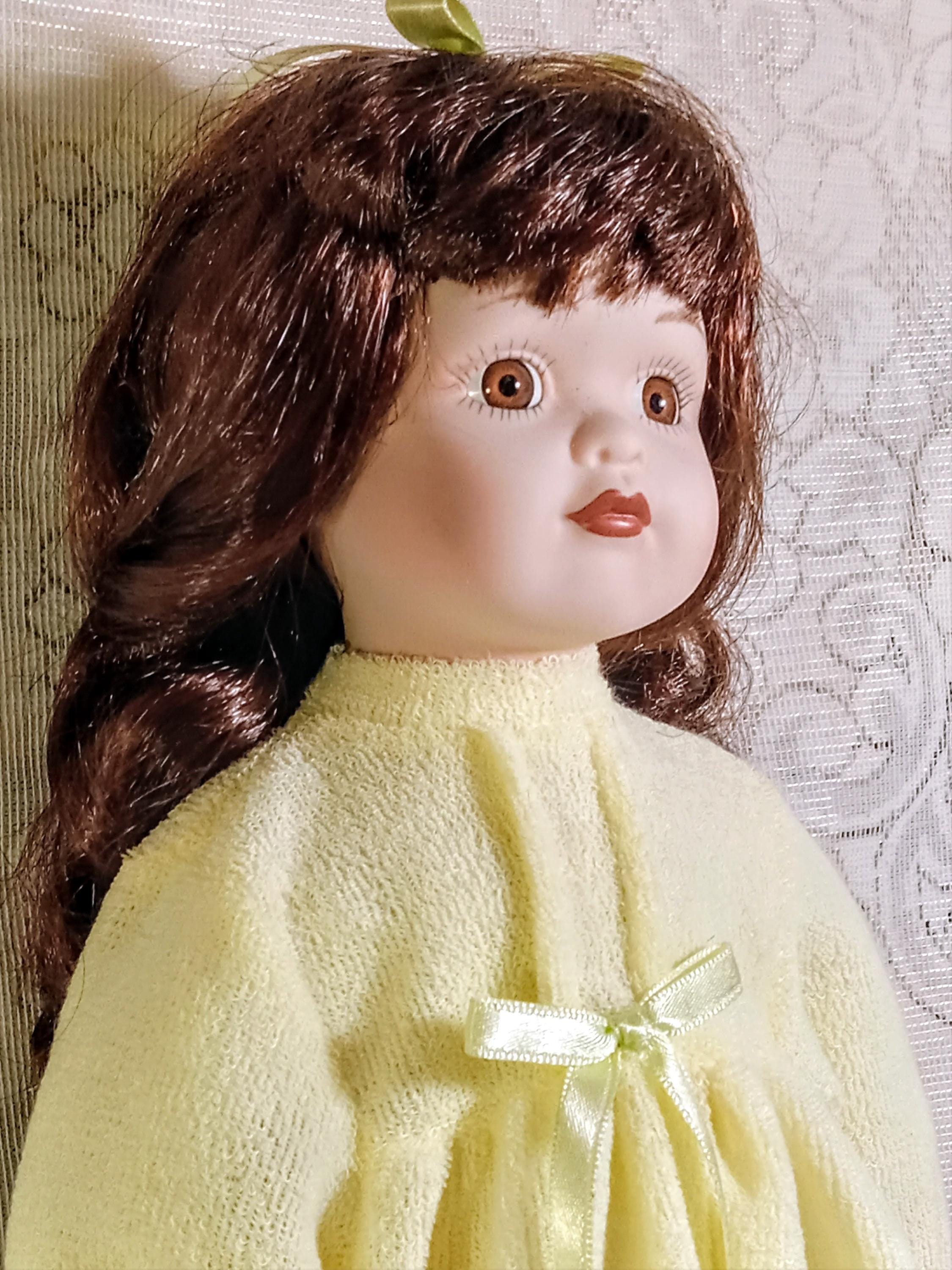 Vintage Porcelain Doll by  Galeria Inc - Includes 2 Dresses
